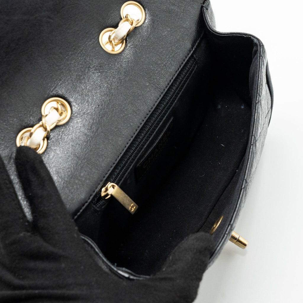 chanel-quilted-flap-bag-white-black-ghw