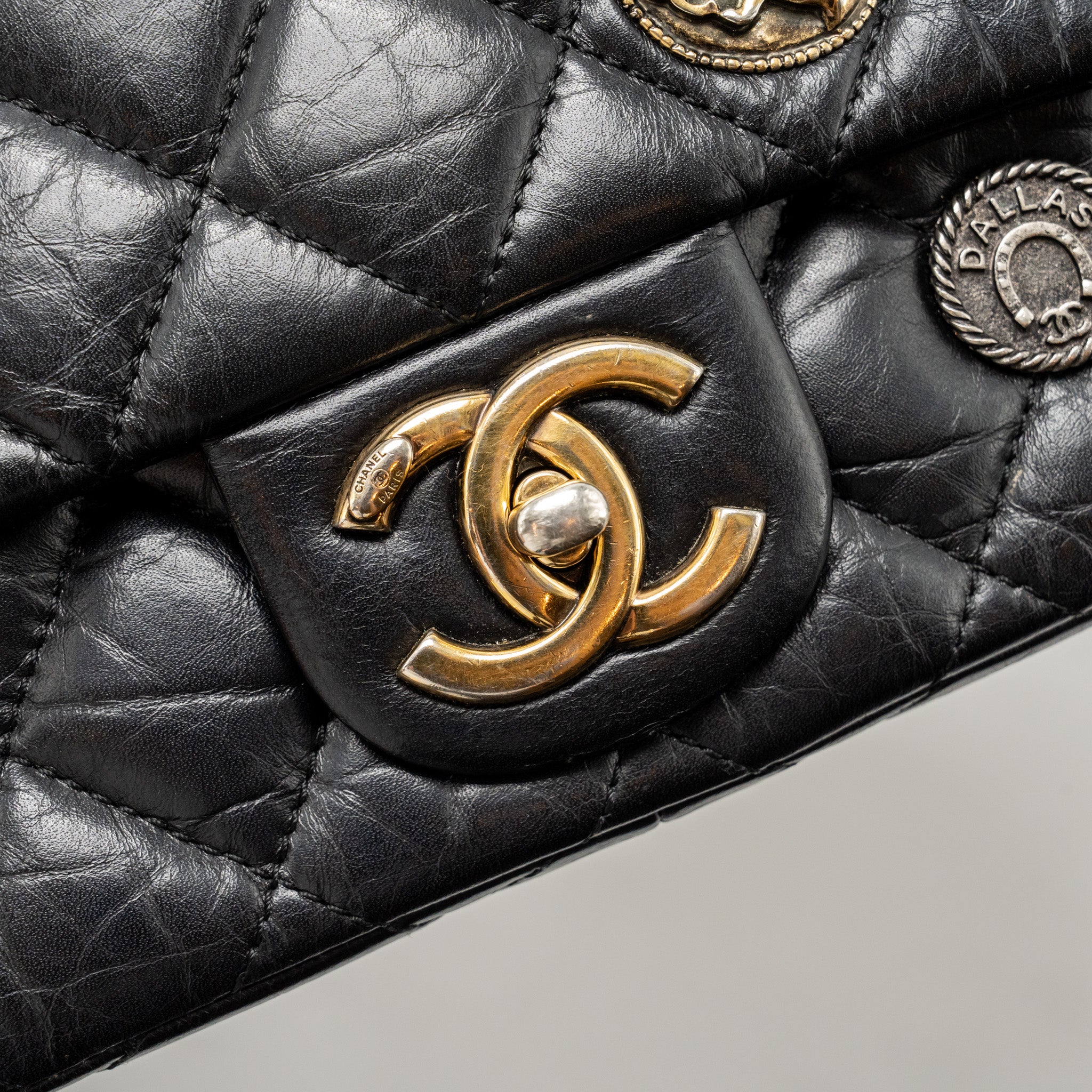 chanel-medallion-quilted-flap-bag-aged-calfskin-black-multicolour-hardware