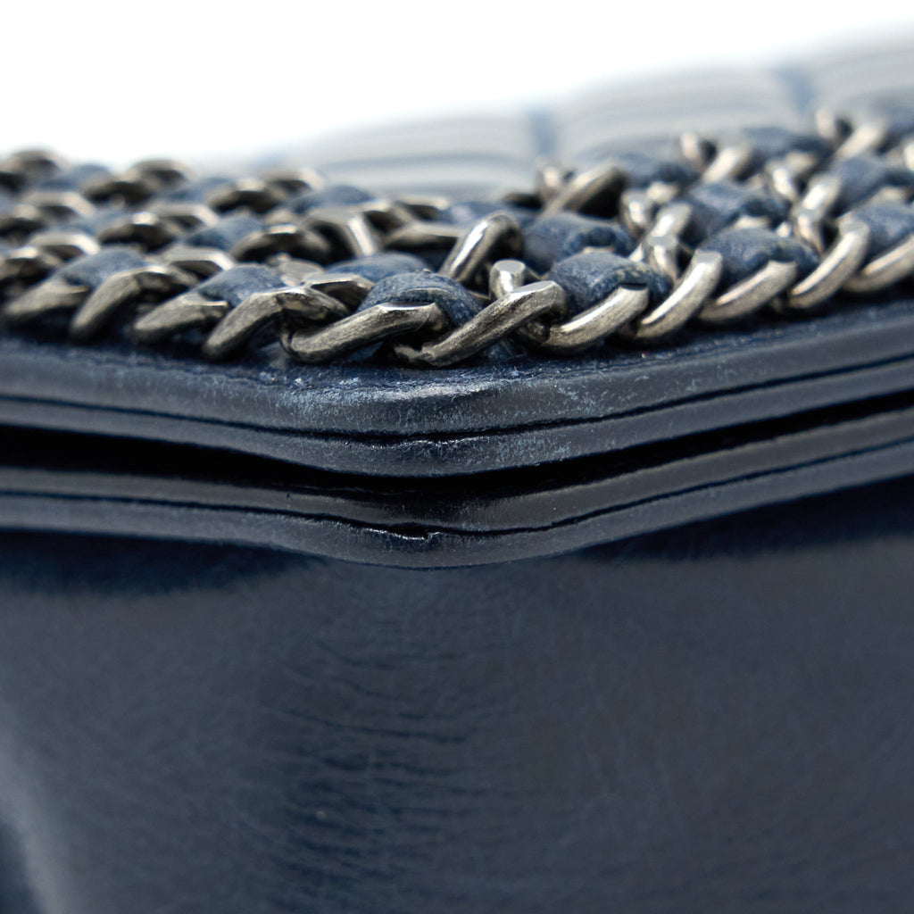 chanel-medium-boy-bag-limited-edition-with-chain-edge-aged-calfskin-navy-ruthenium-hardware