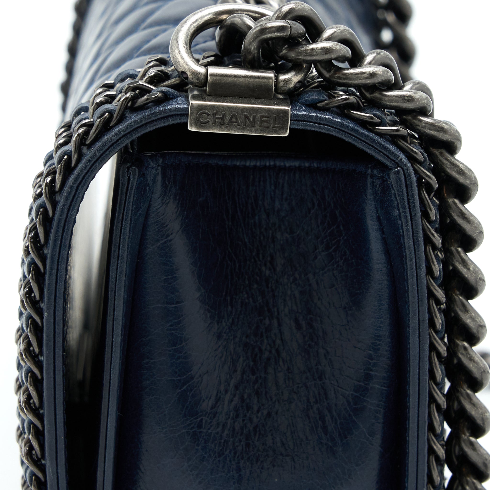 chanel-medium-boy-bag-limited-edition-with-chain-edge-aged-calfskin-navy-ruthenium-hardware