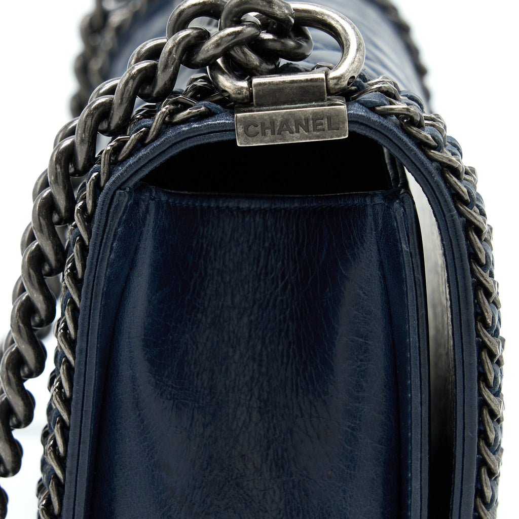 chanel-medium-boy-bag-limited-edition-with-chain-edge-aged-calfskin-navy-ruthenium-hardware