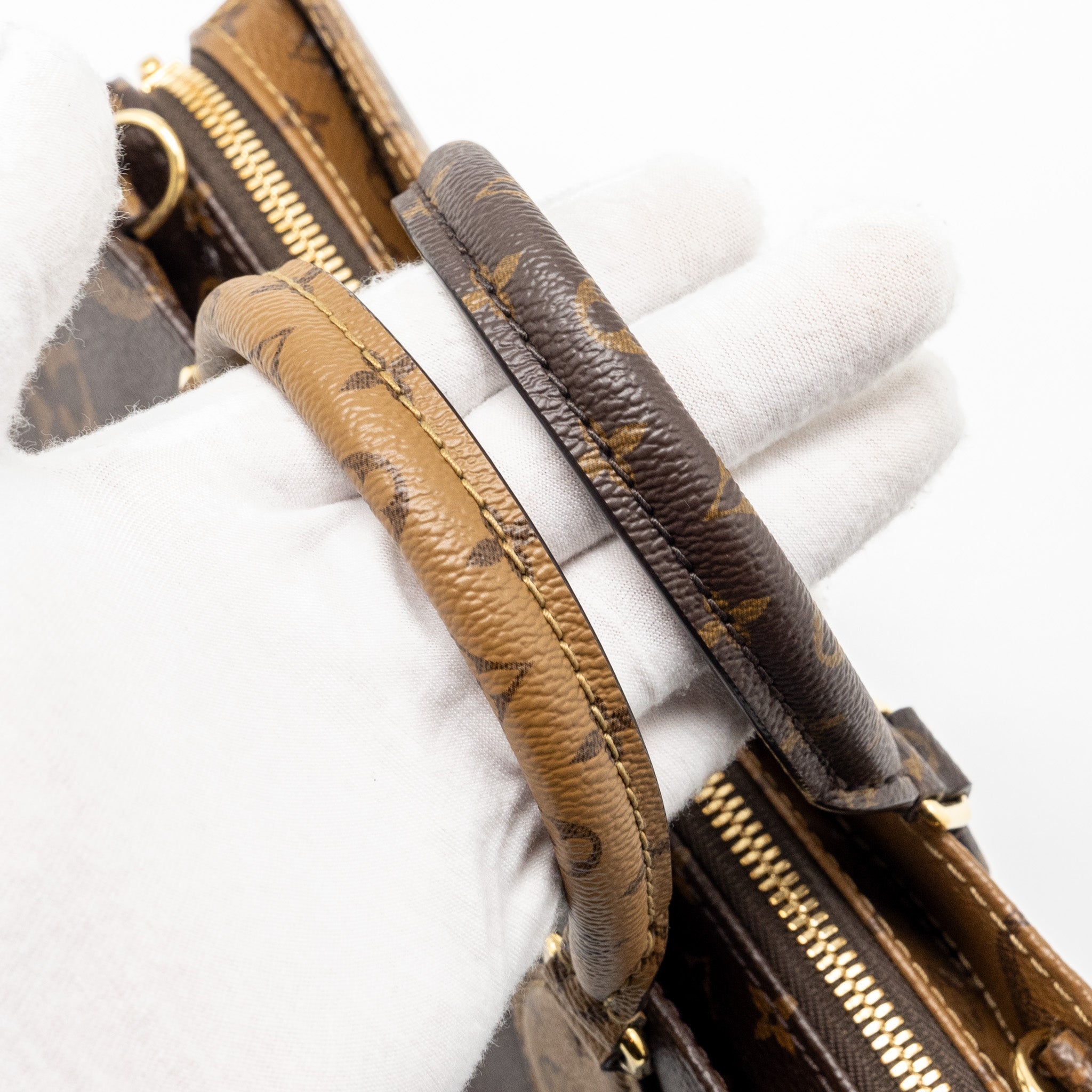 louis-vuitton-onthego-east-west-monogram-reverse-ghw