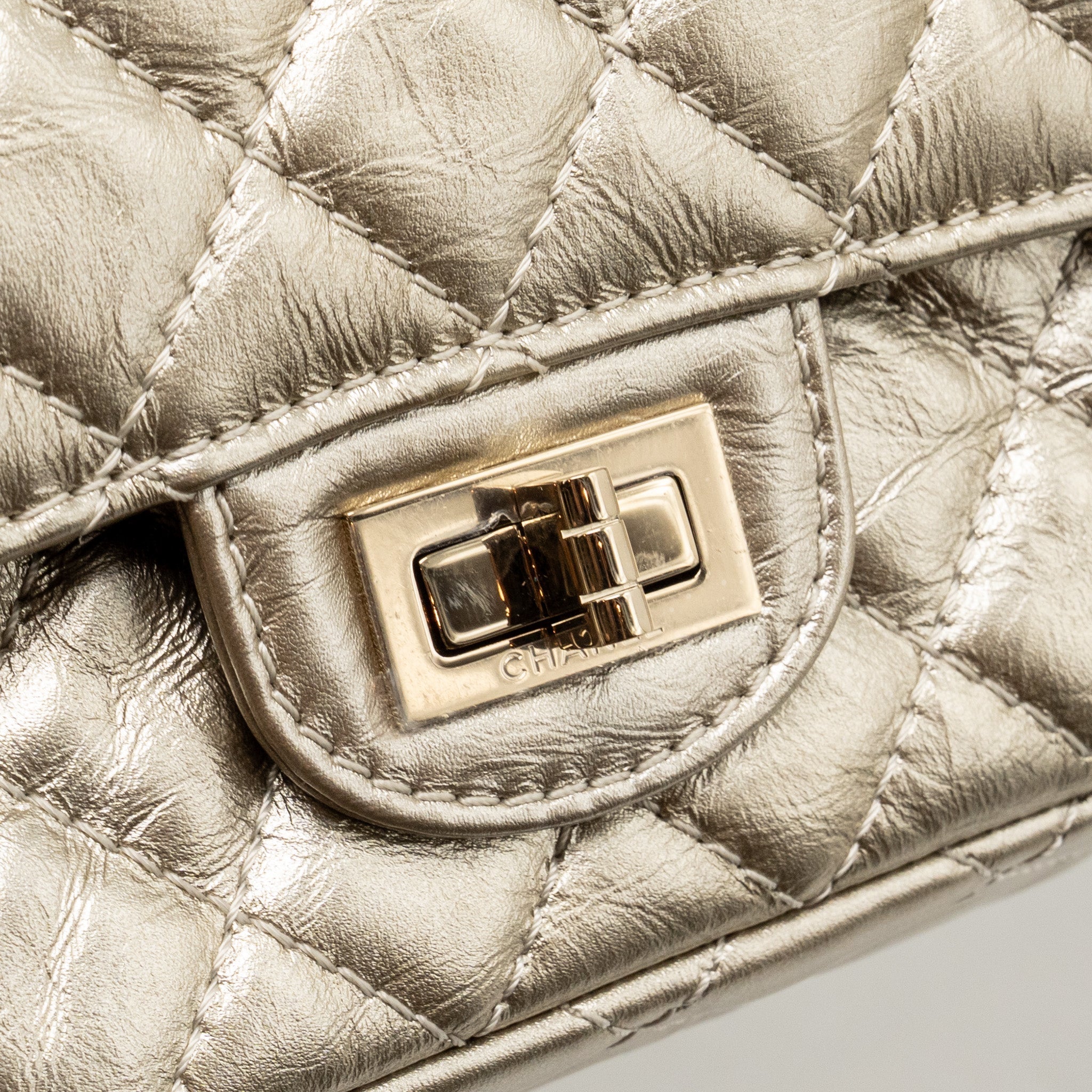 chanel-small-2-55-reissue-double-flap-bag-aged-calfskin-metallic-light-gold-with-lghw