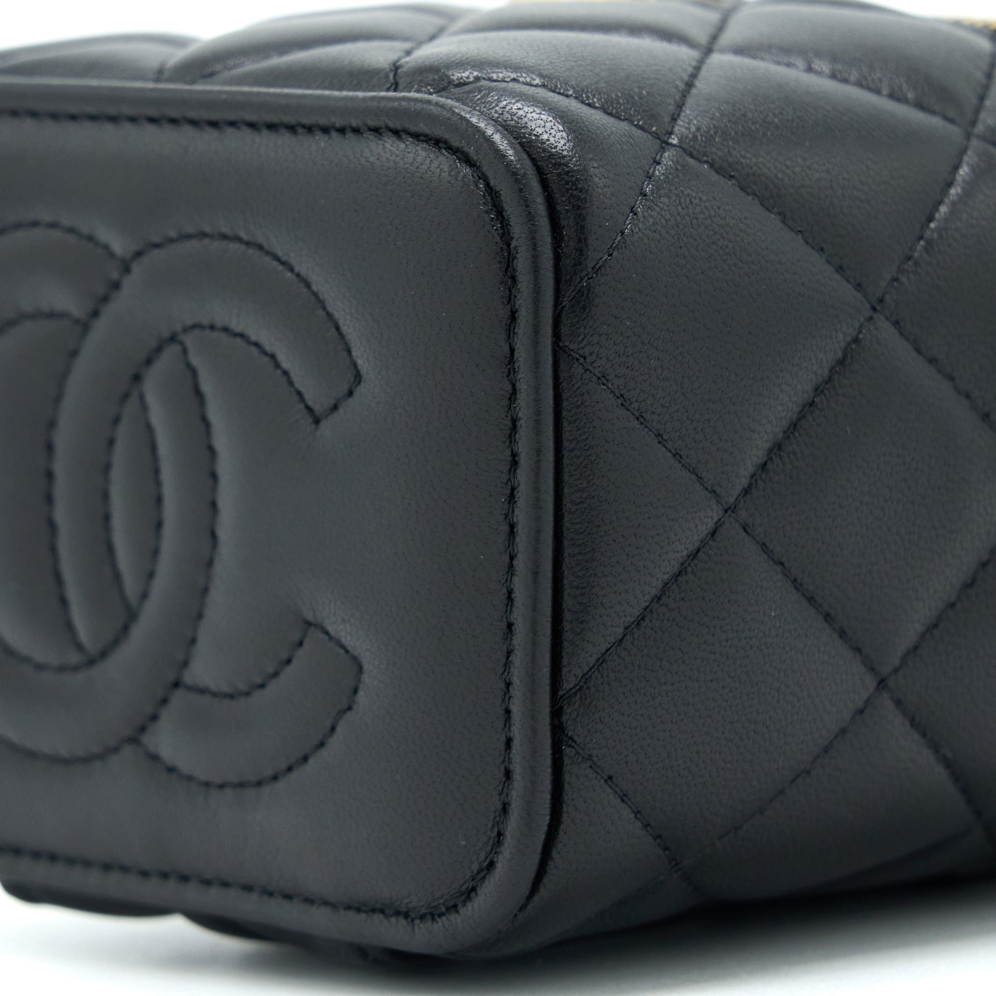 chanel-22b-detailed-top-handle-mini-vanity-with-chain-lambskin-black-brushed-ghw
