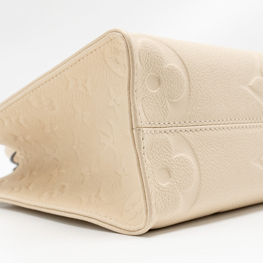 louis-vuitton-onthego-pm-monogram-empreinte-leather-creme-ghw