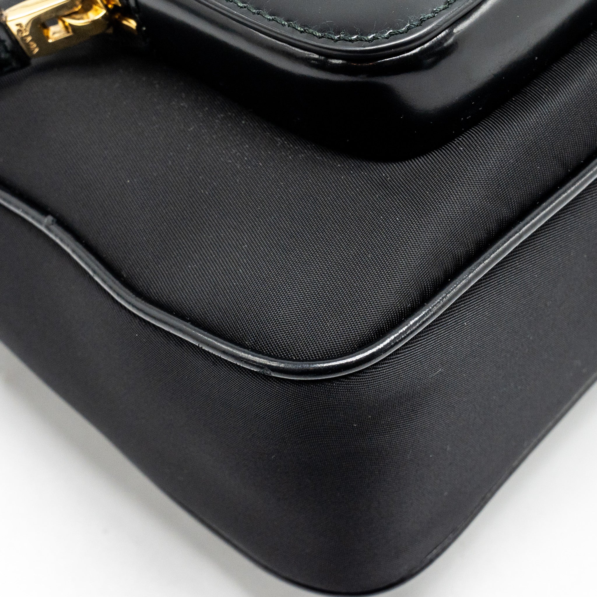 prada-re-nylon-mini-bag-nylon-calfskin-black-ghw