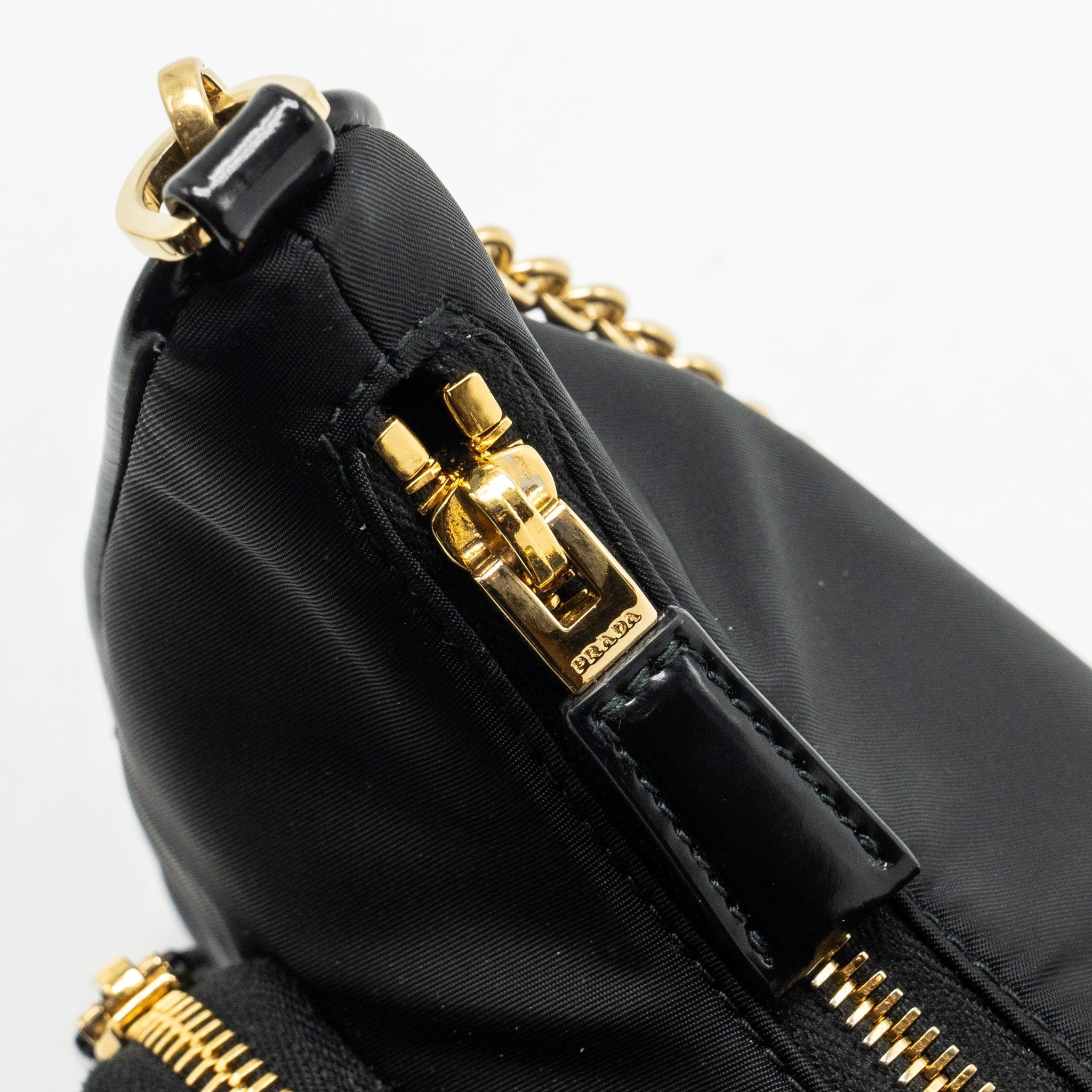prada-re-nylon-mini-bag-nylon-calfskin-black-ghw