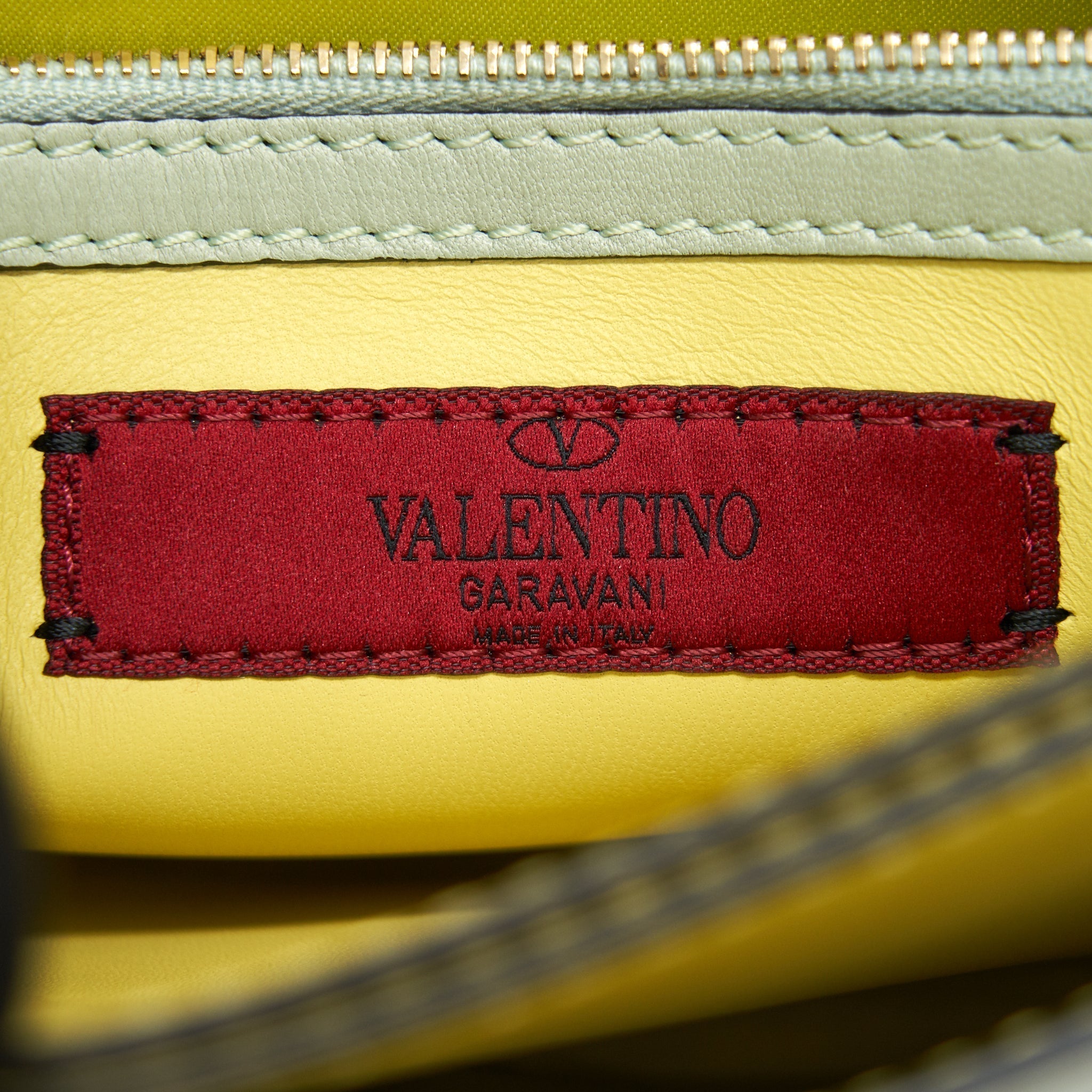 valentino-garavani-rockstud-leather-clutch-bag-multicolored