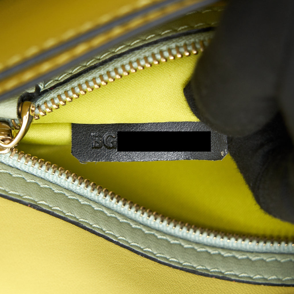 valentino-garavani-rockstud-leather-clutch-bag-multicolored