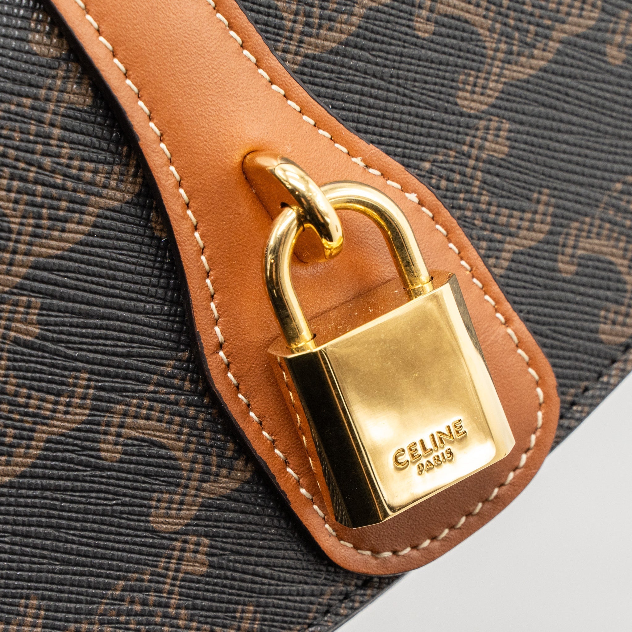 celine-clutch-on-strap-tabou-calfskin-triomphe-canvas-tan-ghw