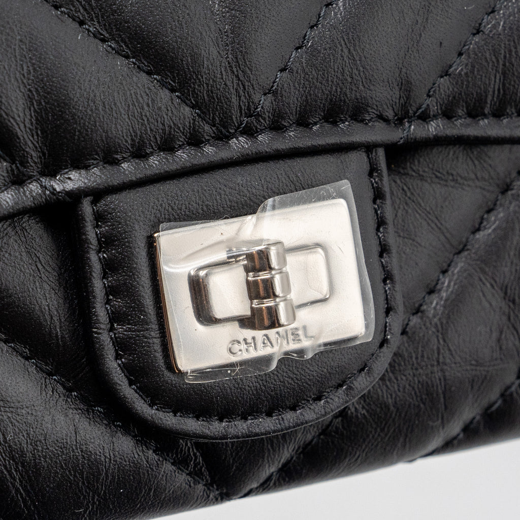chanel-2-55-reissue-flap-card-holder-aged-calfskin-black-shw-microchip