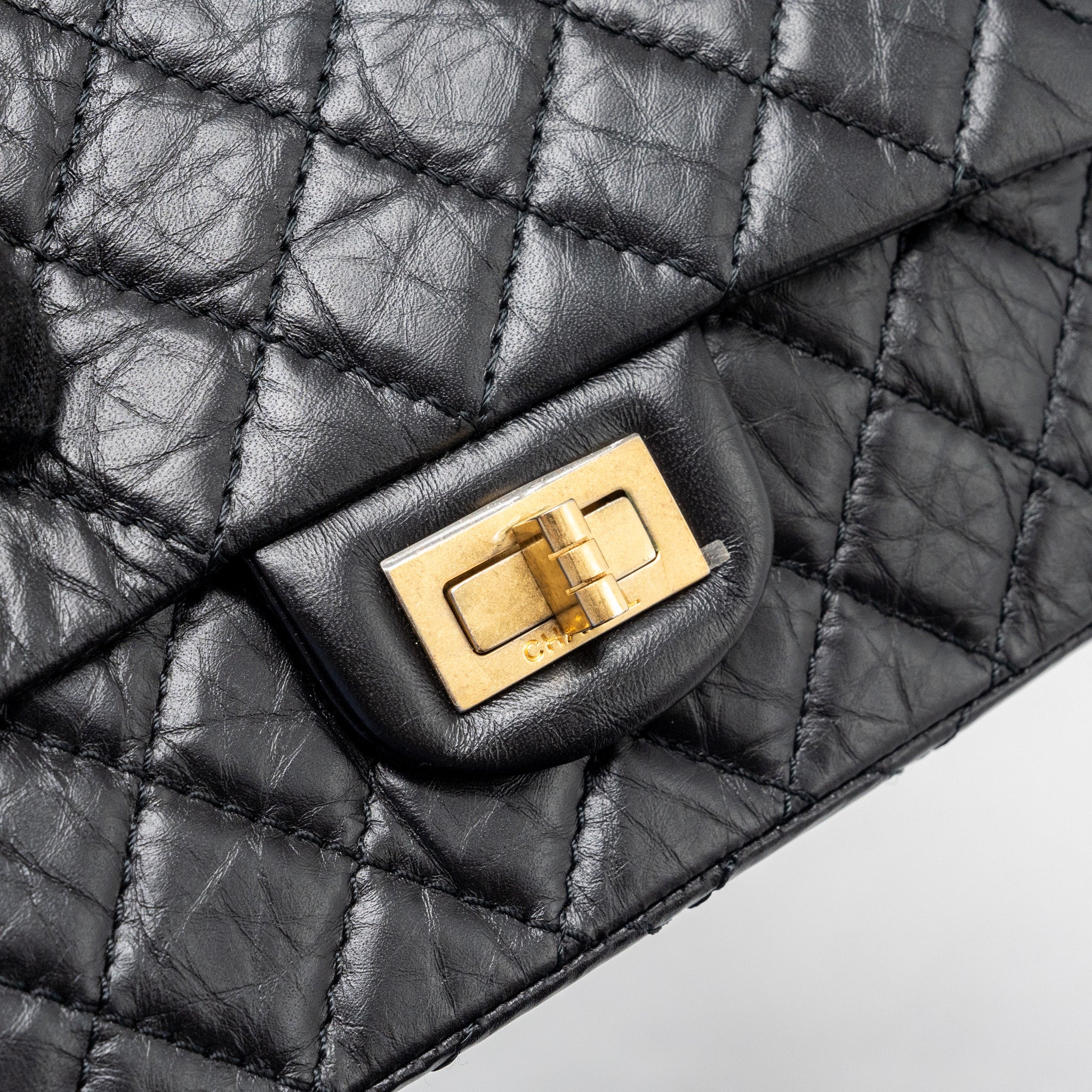 chanel-mini-2-55-reissue-flap-bag-aged-calfskin-black-ghw-1