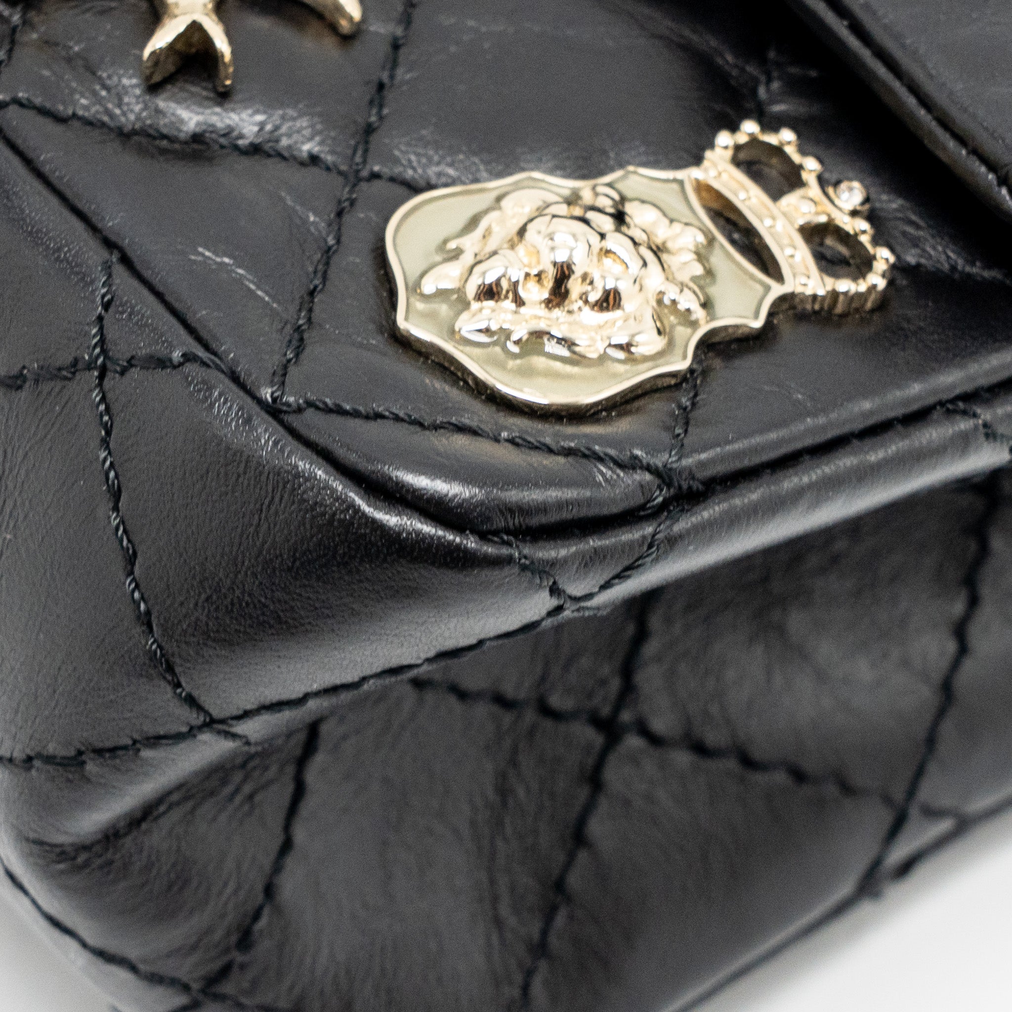 chanel-mini-2-55-reissue-flap-bag-lucky-charms-aged-calfskin-black-ghw