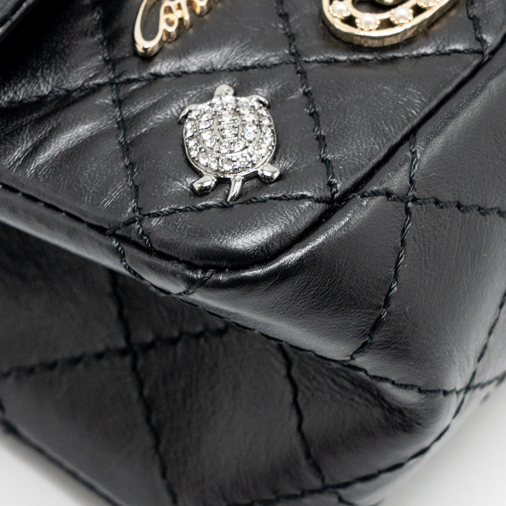 chanel-mini-2-55-reissue-flap-bag-lucky-charms-aged-calfskin-black-ghw