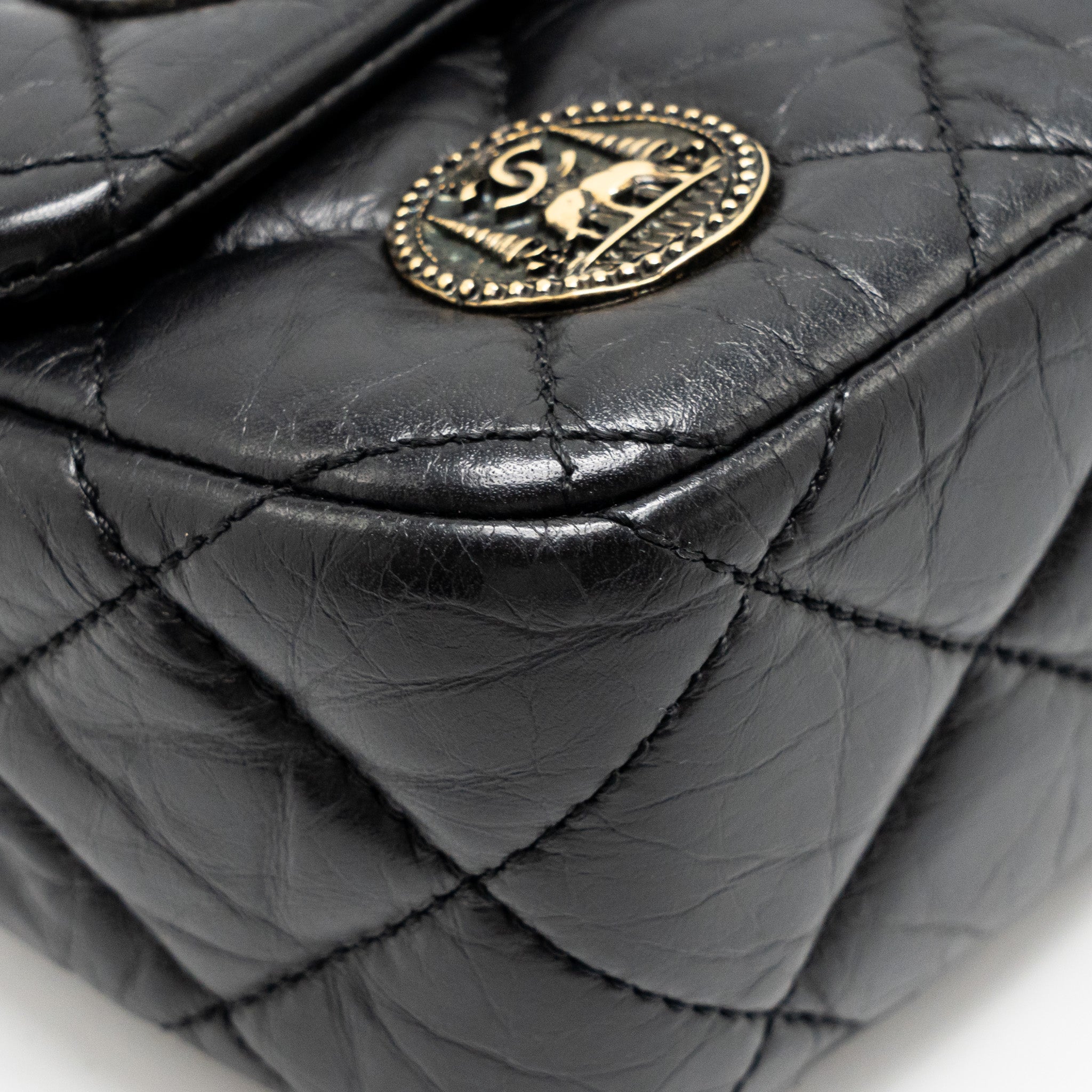 chanel-medallion-quilted-flap-bag-aged-calfskin-black-multicolour-hardware
