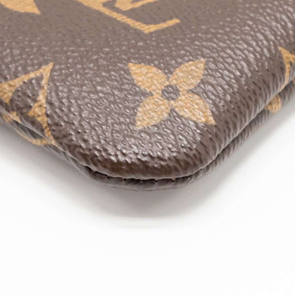 louis-vuitton-travel-stickers-city-pouch-monogram-canvas-ghw