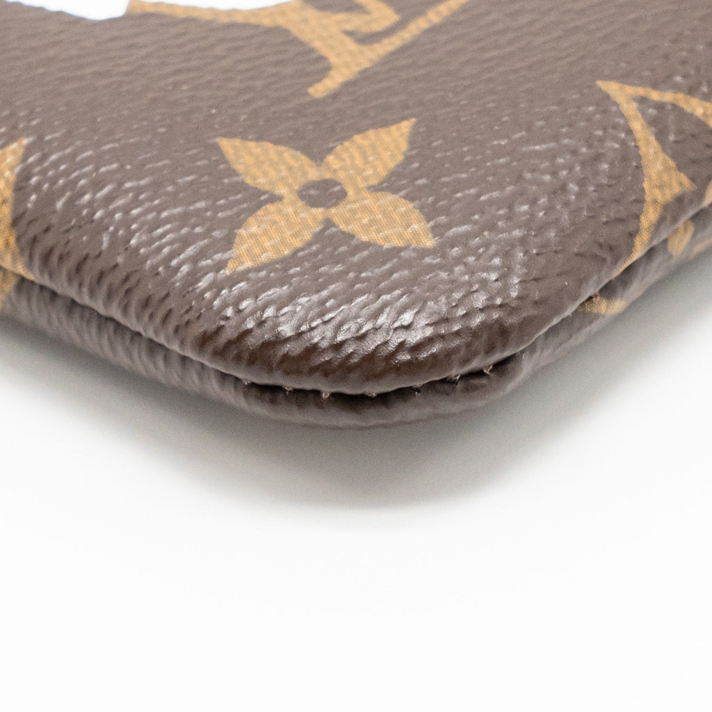 louis-vuitton-travel-stickers-city-pouch-monogram-canvas-ghw