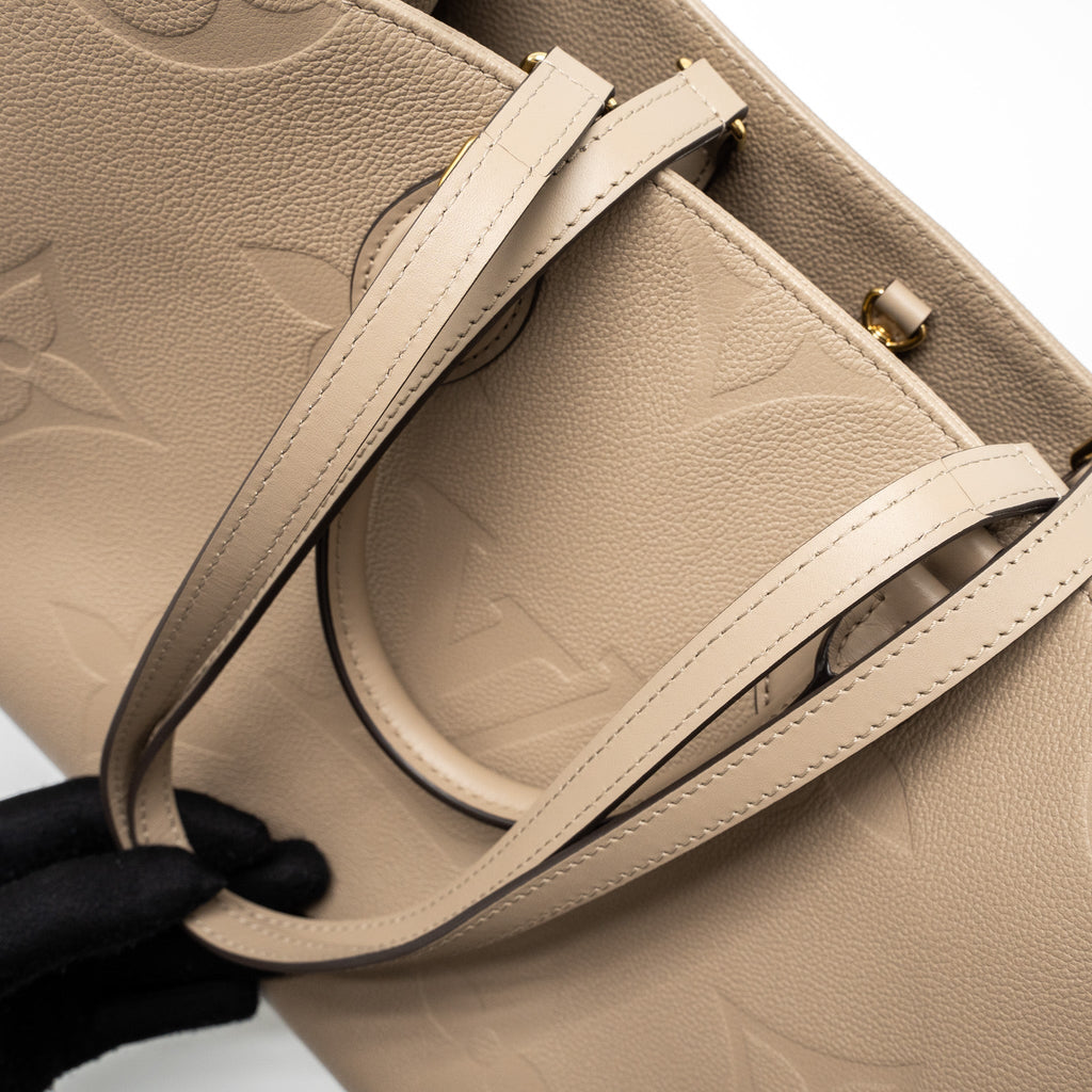copy-of-louis-vuitton-on-the-go-mm-monogram-empreinte-tourterelle-ghw
