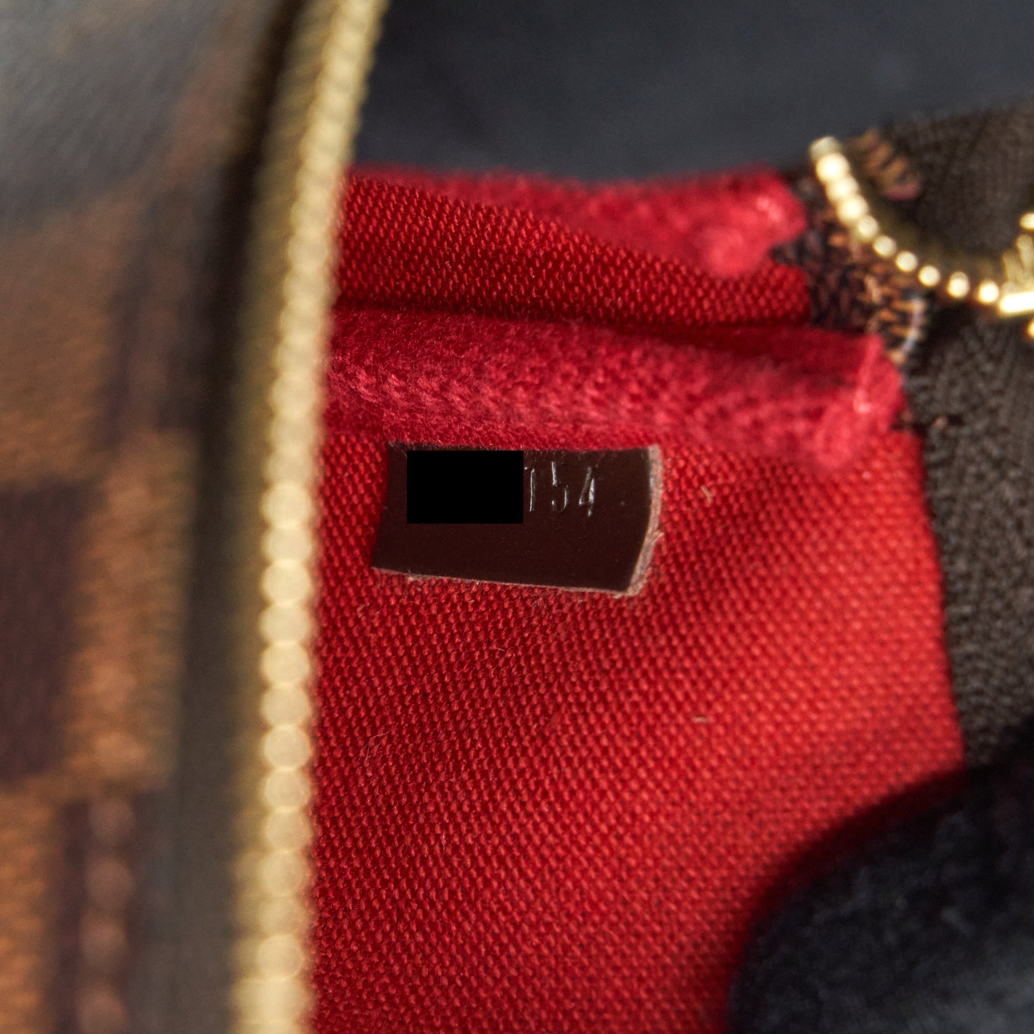 louis-vuitton-mini-pochette-damier-ebene-ghw