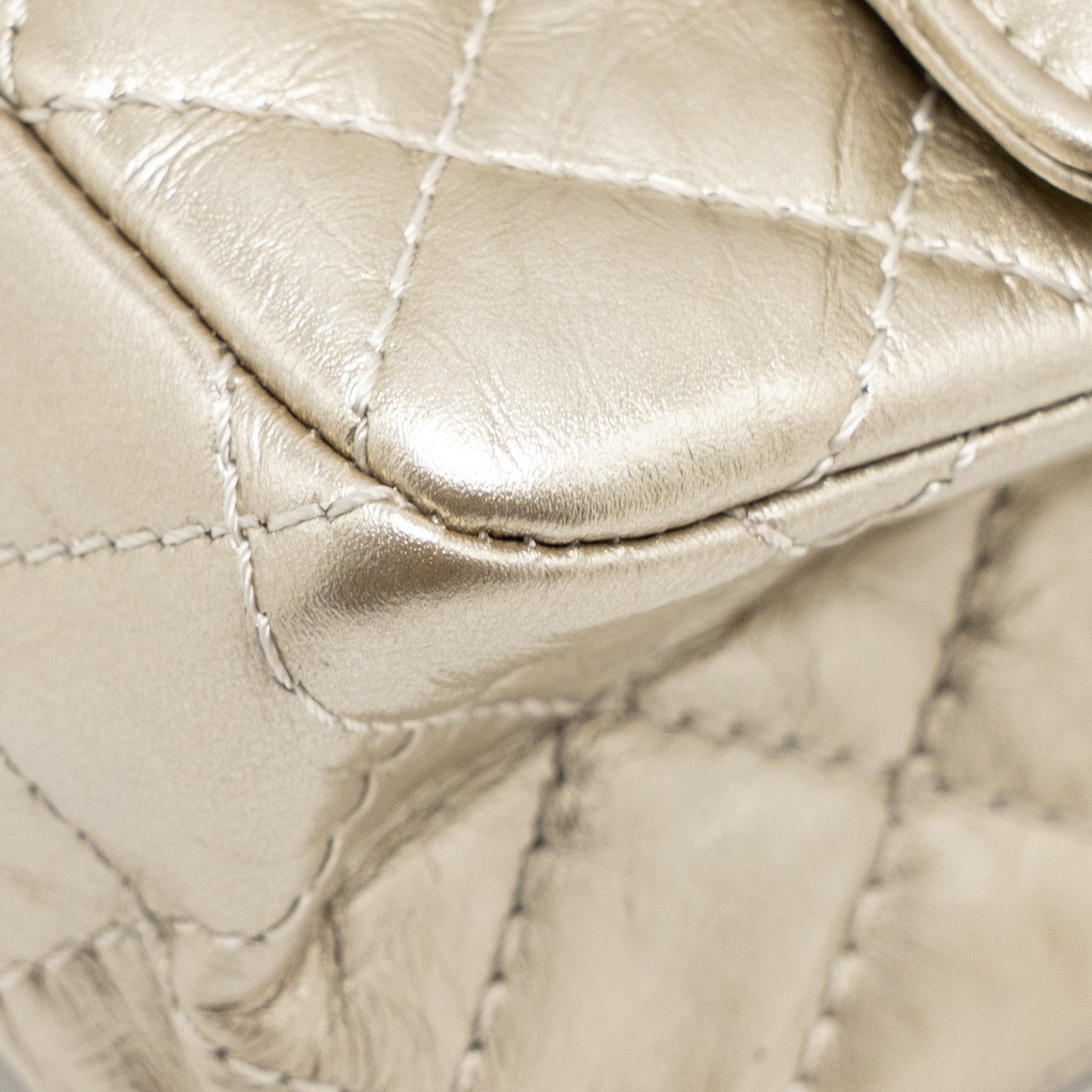 chanel-small-2-55-reissue-double-flap-bag-aged-calfskin-metallic-light-gold-with-lghw
