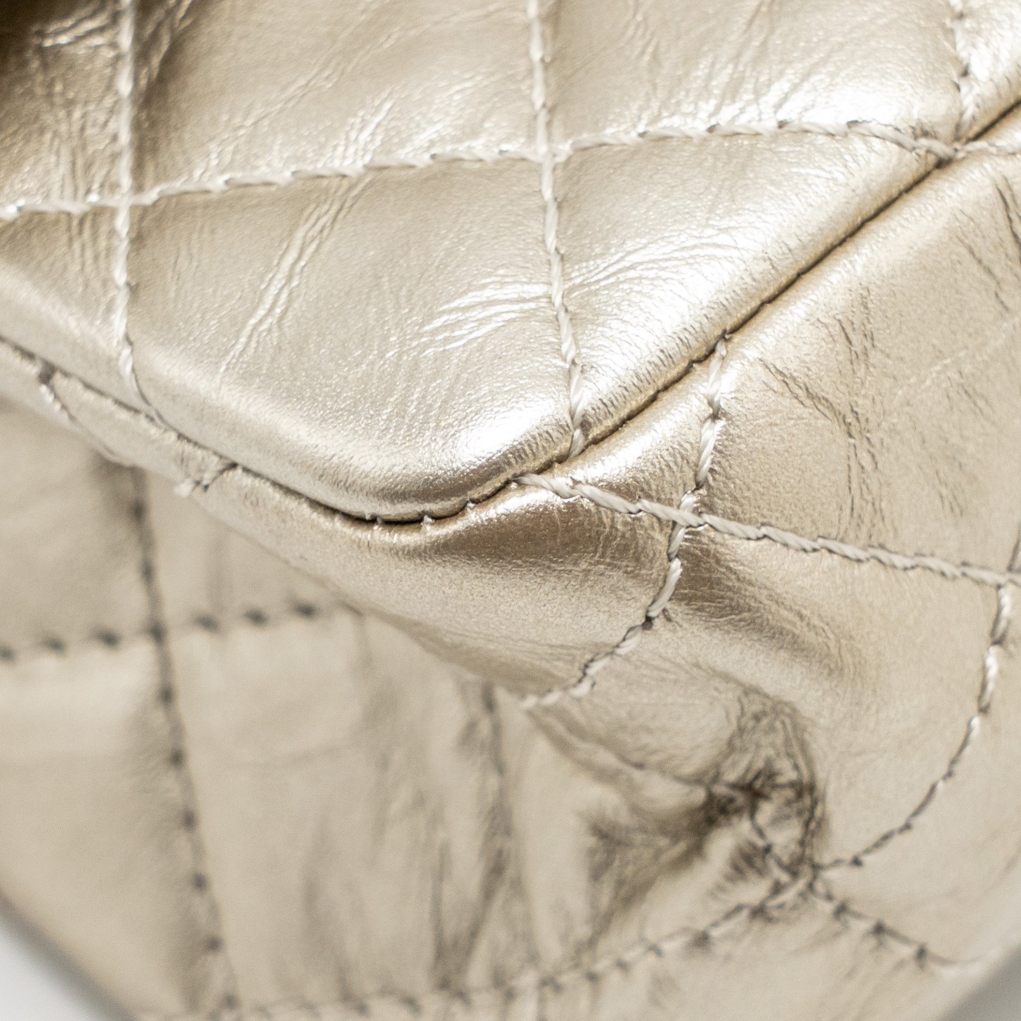 chanel-small-2-55-reissue-double-flap-bag-aged-calfskin-metallic-light-gold-with-lghw