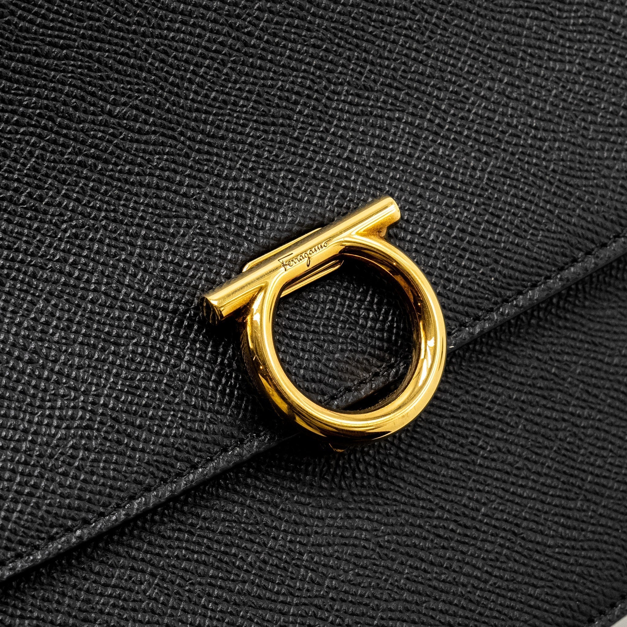salvatore-ferragamo-gancini-rounded-flap-bag-calfskin-black-ghw