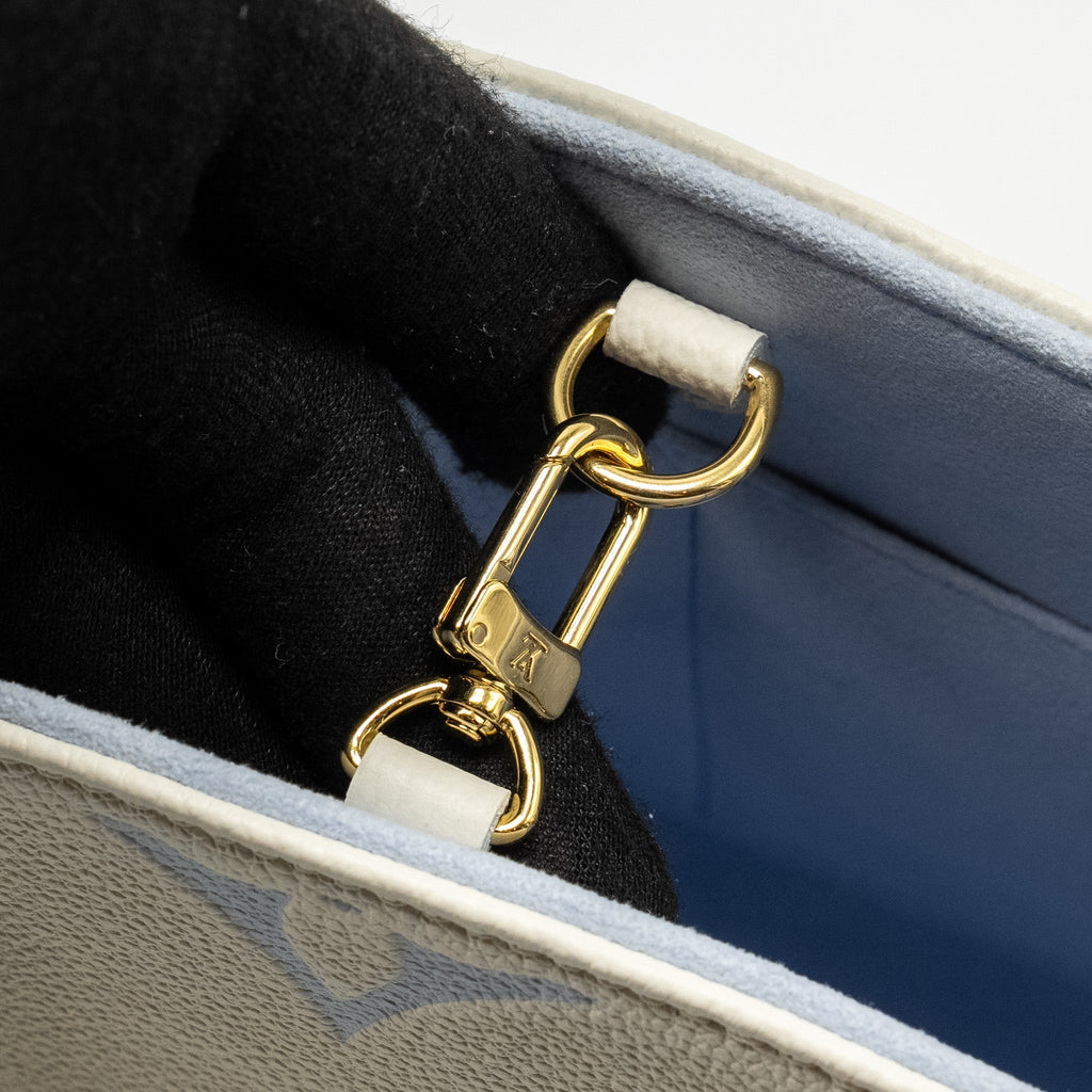 louis-vuitton-onthego-pm-bicolour-monogram-empreinte-latte-candy-blue