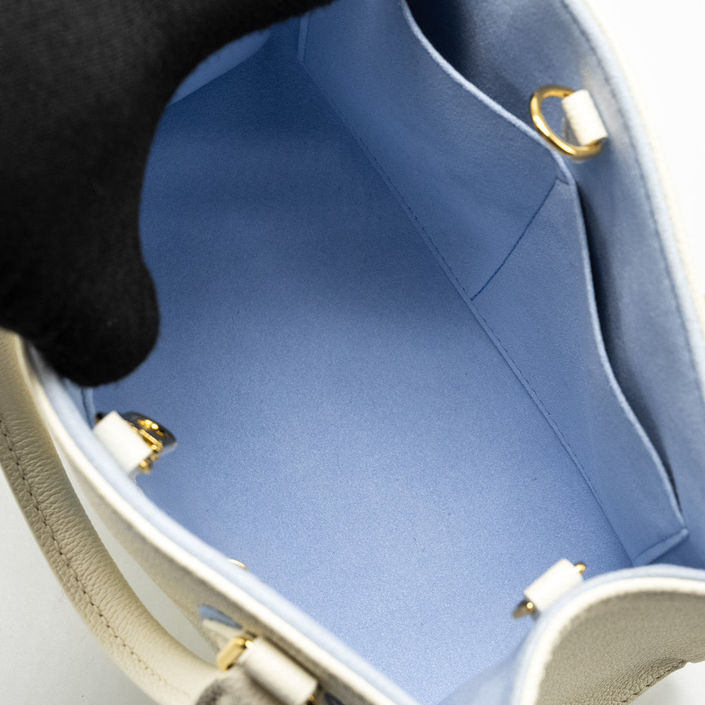 louis-vuitton-onthego-pm-bicolour-monogram-empreinte-latte-candy-blue