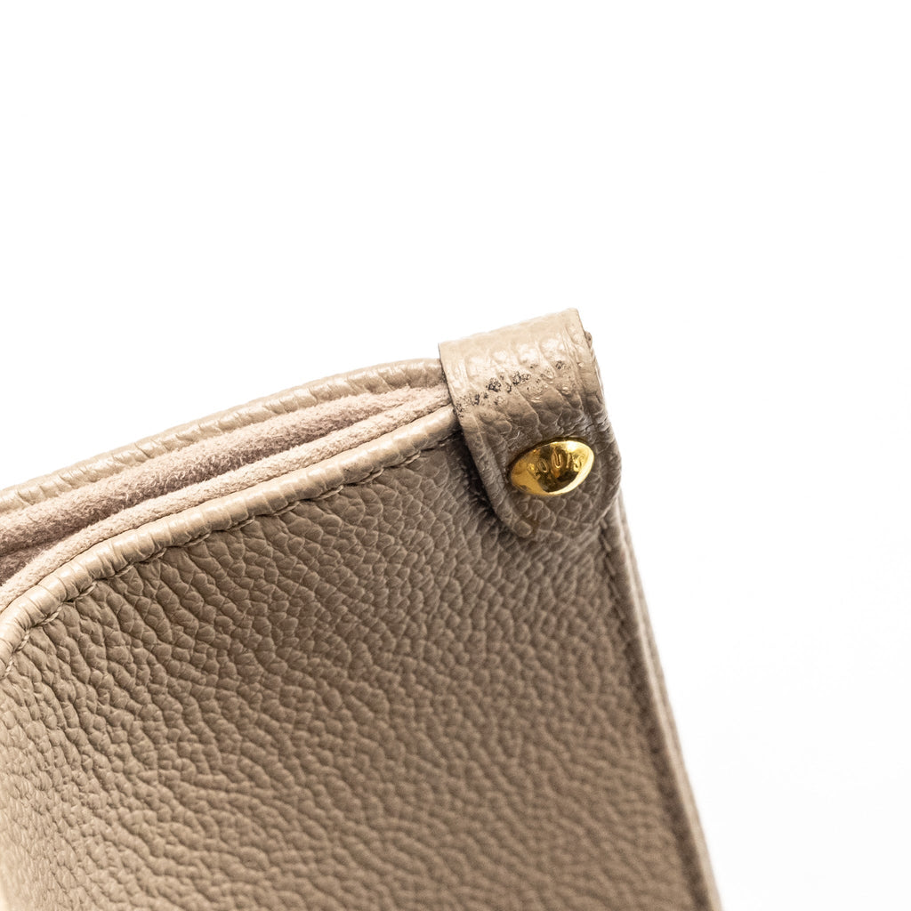 louis-vuitton-on-the-go-pm-bicolour-monogram-empreinte-leather-tourterelle-creme-ghw